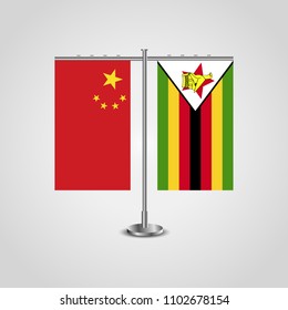 Table stand with flags of China and Zimbabwe.Two flag. Flag pole. Symbolizing the cooperation between the two countries. Table flags