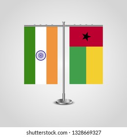 Table stand with flags of India and Guinea-Bissau.Two flag. Flag pole. Symbolizing the cooperation between the two countries. Table flags