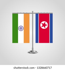 Table stand with flags of India and North Korea.Two flag. Flag pole. Symbolizing the cooperation between the two countries. Table flags