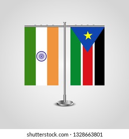 Table stand with flags of India and Southern Sudan.Two flag. Flag pole. Symbolizing the cooperation between the two countries. Table flags