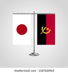 Table stand with flags of Japan and Angola.Two flag. Flag pole. Symbolizing the cooperation between the two countries. Table flags