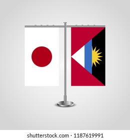 Table stand with flags of Japan and Antigua and Barbuda.Two flag. Flag pole. Symbolizing the cooperation between the two countries. Table flags