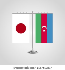 Table stand with flags of Japan and Azerbaijan.Two flag. Flag pole. Symbolizing the cooperation between the two countries. Table flags