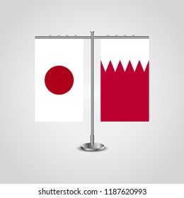 Table stand with flags of Japan and Bahrain.Two flag. Flag pole. Symbolizing the cooperation between the two countries. Table flags