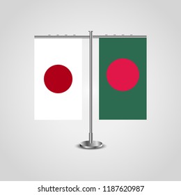 Table stand with flags of Japan and Bangladesh.Two flag. Flag pole. Symbolizing the cooperation between the two countries. Table flags