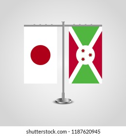 Table stand with flags of Japan and Burundi.Two flag. Flag pole. Symbolizing the cooperation between the two countries. Table flags