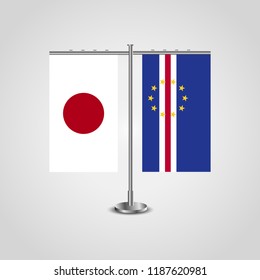 Table stand with flags of Japan and Cape Verde.Two flag. Flag pole. Symbolizing the cooperation between the two countries. Table flags