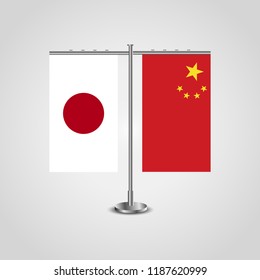 Table stand with flags of Japan and China.Two flag. Flag pole. Symbolizing the cooperation between the two countries. Table flags
