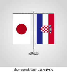 Table stand with flags of Japan and Croatia.Two flag. Flag pole. Symbolizing the cooperation between the two countries. Table flags