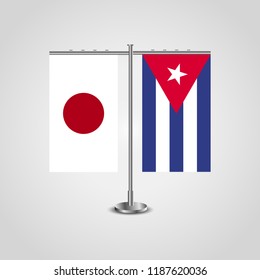 Table stand with flags of Japan and Cuba.Two flag. Flag pole. Symbolizing the cooperation between the two countries. Table flags