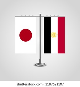 Table stand with flags of Japan and Egypt.Two flag. Flag pole. Symbolizing the cooperation between the two countries. Table flags