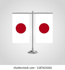 Table stand with flags of Japan and Japan.Two flag. Flag pole. Symbolizing the cooperation between the two countries. Table flags