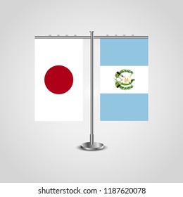 Table stand with flags of Japan and Guatemala.Two flag. Flag pole. Symbolizing the cooperation between the two countries. Table flags
