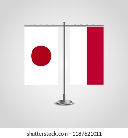 Table stand with flags of Japan and Indonesia.Two flag. Flag pole. Symbolizing the cooperation between the two countries. Table flags