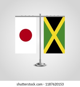 Table stand with flags of Japan and Jamaica.Two flag. Flag pole. Symbolizing the cooperation between the two countries. Table flags