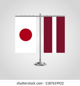 Table stand with flags of Japan and Latvia.Two flag. Flag pole. Symbolizing the cooperation between the two countries. Table flags