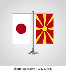 Table stand with flags of Japan and Macedonia.Two flag. Flag pole. Symbolizing the cooperation between the two countries. Table flags