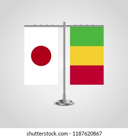 Table stand with flags of Japan and Mali.Two flag. Flag pole. Symbolizing the cooperation between the two countries. Table flags