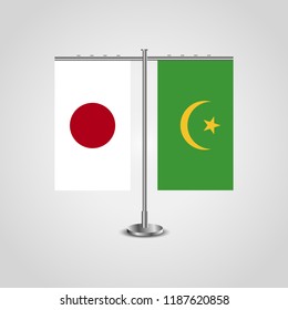 Table stand with flags of Japan and Mauritania.Two flag. Flag pole. Symbolizing the cooperation between the two countries. Table flags