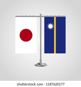 Table stand with flags of Japan and Nauru.Two flag. Flag pole. Symbolizing the cooperation between the two countries. Table flags