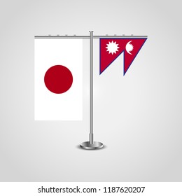Table stand with flags of Japan and Nepal.Two flag. Flag pole. Symbolizing the cooperation between the two countries. Table flags
