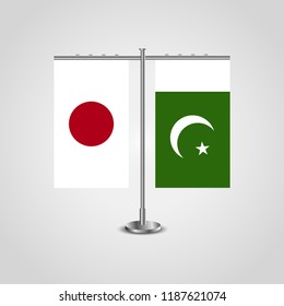 Table stand with flags of Japan and Pakistan.Two flag. Flag pole. Symbolizing the cooperation between the two countries. Table flags