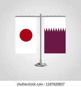 Table stand with flags of Japan and Qatar.Two flag. Flag pole. Symbolizing the cooperation between the two countries. Table flags