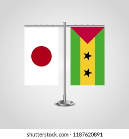 Table stand with flags of Japan and Sao Tome and Principe.Two flag. Flag pole. Symbolizing the cooperation between the two countries. Table flags