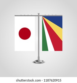 Table stand with flags of Japan and Seychelles.Two flag. Flag pole. Symbolizing the cooperation between the two countries. Table flags