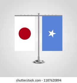 Table stand with flags of Japan and Somalia.Two flag. Flag pole. Symbolizing the cooperation between the two countries. Table flags