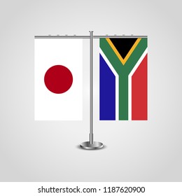 Table stand with flags of Japan and South Africa.Two flag. Flag pole. Symbolizing the cooperation between the two countries. Table flags