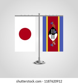 Table stand with flags of Japan and Swaziland.Two flag. Flag pole. Symbolizing the cooperation between the two countries. Table flag
