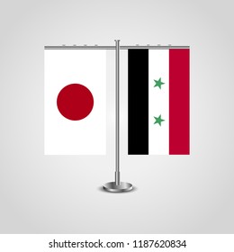 Table stand with flags of Japan and Syria.Two flag. Flag pole. Symbolizing the cooperation between the two countries. Table flags
