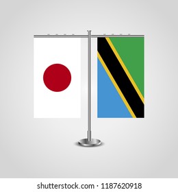 Table stand with flags of Japan and Tanzania.Two flag. Flag pole. Symbolizing the cooperation between the two countries. Table flags