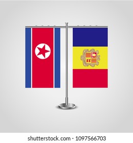 Table stand with flags of North Korea and Andorra.Two flag. Flag pole. Symbolizing the cooperation between the two countries. Table flags