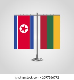 Table stand with flags of North Korea and Lithuania.Two flag. Flag pole. Symbolizing the cooperation between the two countries. Table flags