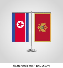 Table stand with flags of North Korea and Montenegro.Two flag. Flag pole. Symbolizing the cooperation between the two countries. Table flags