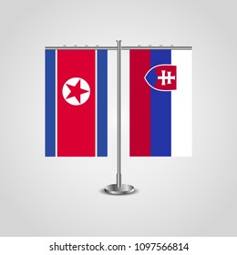 Table stand with flags of North Korea and Slovakia.Two flag. Flag pole. Symbolizing the cooperation between the two countries. Table flags