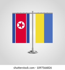 Table stand with flags of North Korea and Ukraine.Two flag. Flag pole. Symbolizing the cooperation between the two countries. Table flags