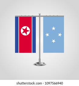 Table stand with flags of North Korea and Micronesia.Two flag. Flag pole. Symbolizing the cooperation between the two countries. Table flags
