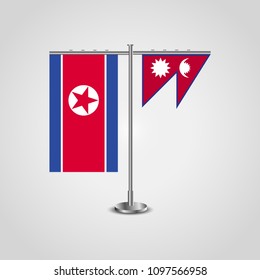 Table stand with flags of North Korea and Nepal.Two flag. Flag pole. Symbolizing the cooperation between the two countries. Table flags