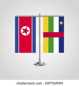 Table stand with flags of North Korea and Central African Republic.Two flag. Flag pole. Symbolizing the cooperation between the two countries. Table flags