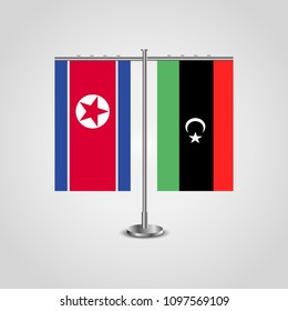 Table stand with flags of North Korea and Libya.Two flag. Flag pole. Symbolizing the cooperation between the two countries. Table flags
