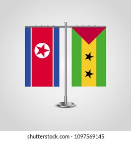 Table stand with flags of North Korea and Sao Tome and Principe.Two flag. Flag pole. Symbolizing the cooperation between the two countries. Table flags