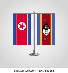 Table stand with flags of North Korea and Swaziland.Two flag. Flag pole. Symbolizing the cooperation between the two countries. Table flags