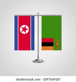 Table stand with flags of North Korea and Zambia.Two flag. Flag pole. Symbolizing the cooperation between the two countries. Table flags