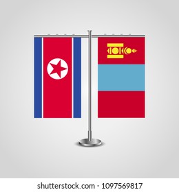 Table stand with flags of North Korea and Mongolia.Two flag. Flag pole. Symbolizing the cooperation between the two countries. Table flags