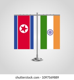 Table stand with flags of North Korea and India.Two flag. Flag pole. Symbolizing the cooperation between the two countries. Table flags