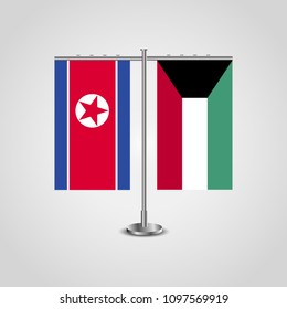 Table stand with flags of North Korea and Kuwait.Two flag. Flag pole. Symbolizing the cooperation between the two countries. Table flags