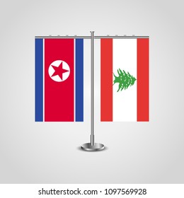 Table stand with flags of North Korea and Lebanon.Two flag. Flag pole. Symbolizing the cooperation between the two countries. Table flags